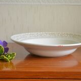 Hollow dish aboard golden flowers