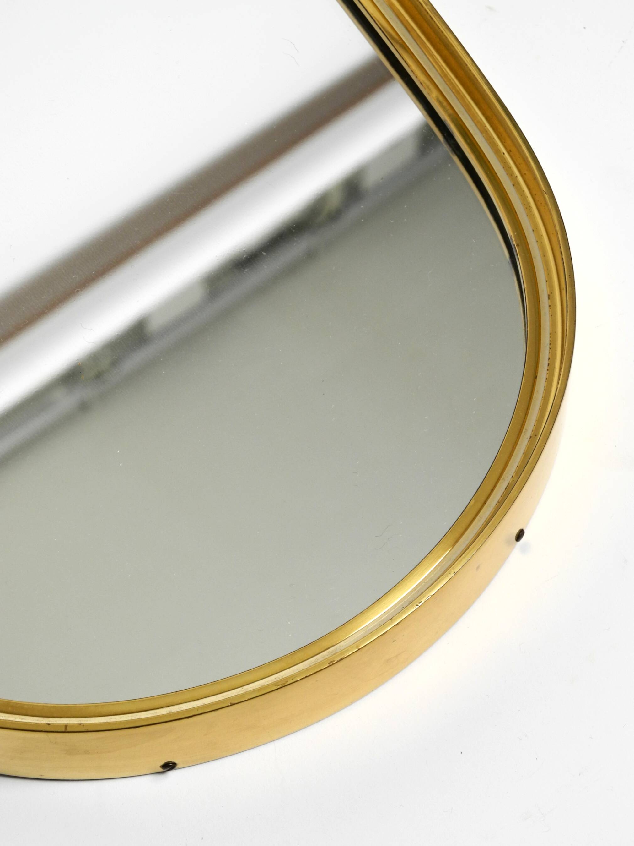 Small solid Mid Century brass wall mirror by Münchener Zierspiegel