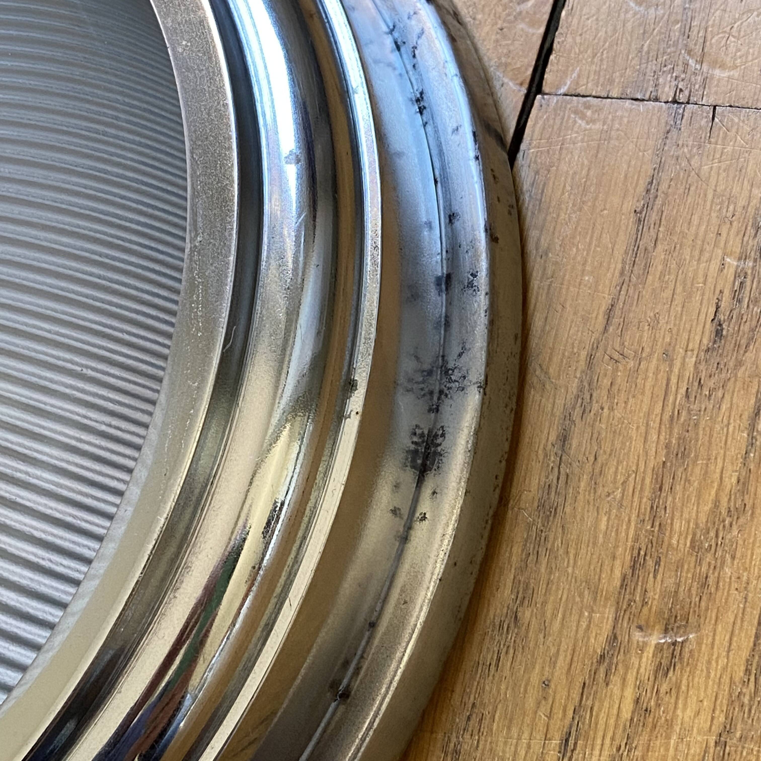 Thick glass ceiling light fixture with a chrome metal support, Holophane type.