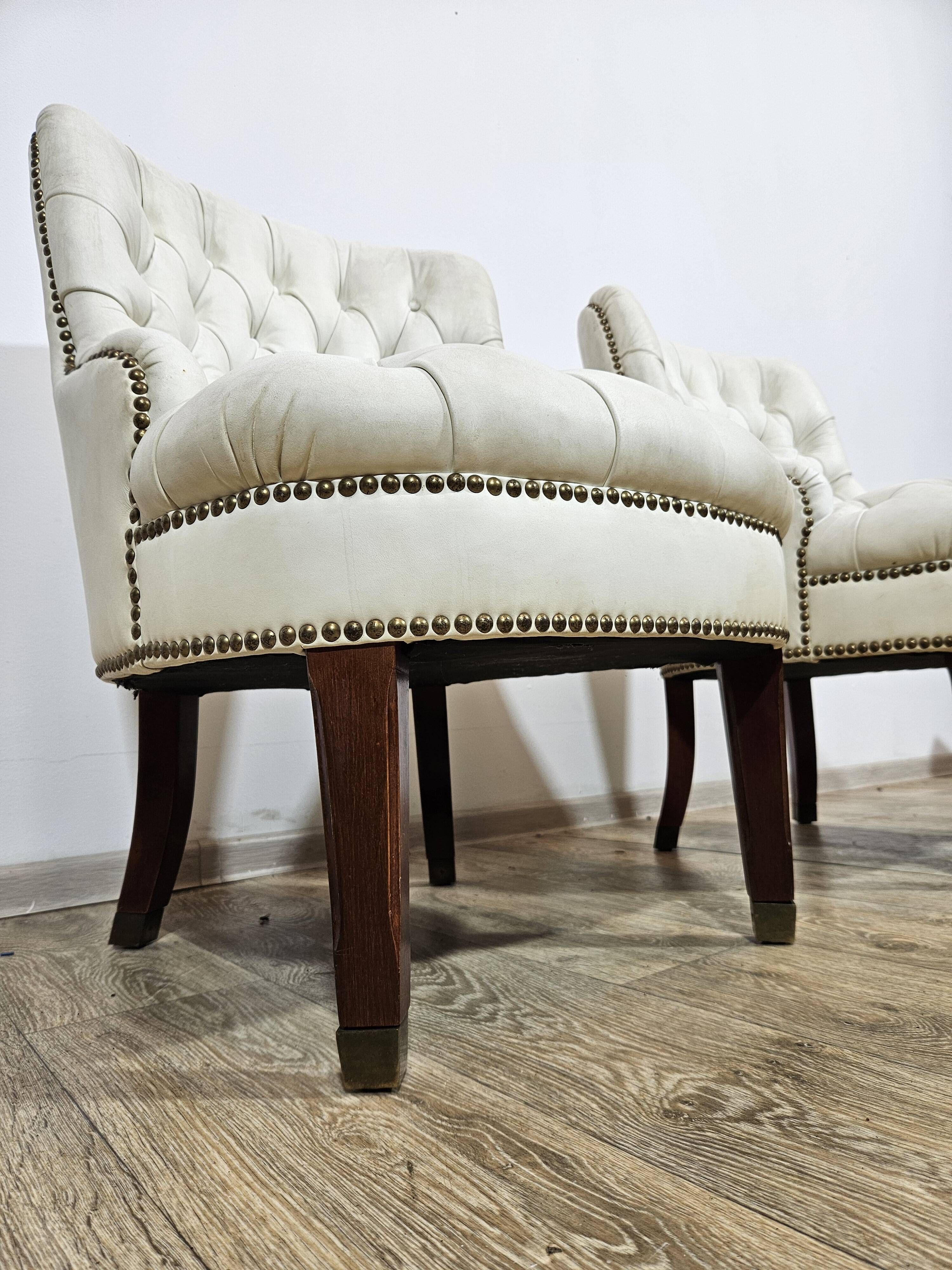 A pair of chesterfield armchairs, England, 1960s