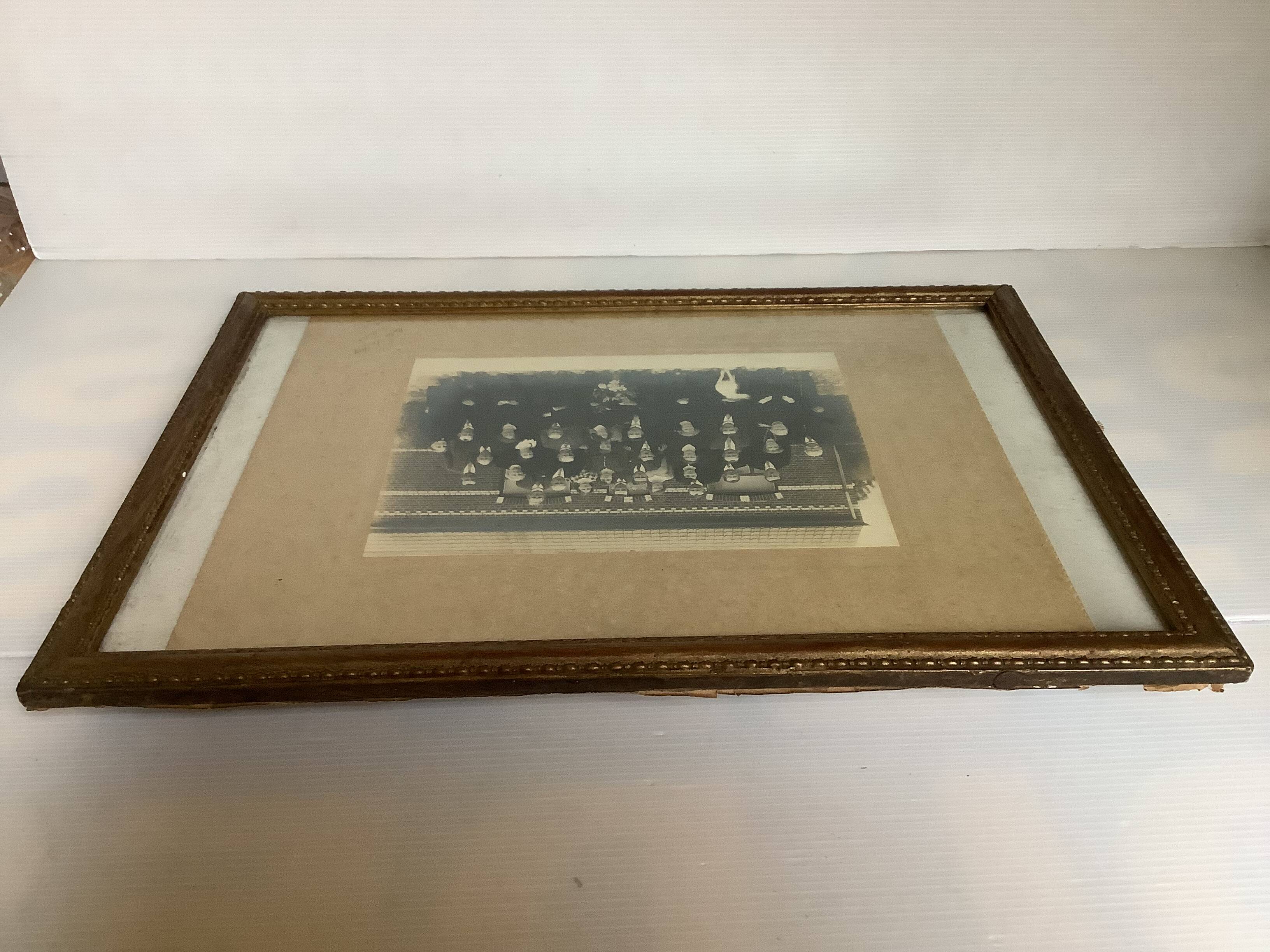 Old photograph of a newlywed couple with a dog