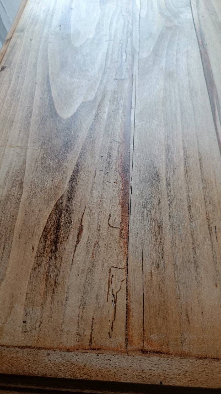 Antique wooden desk with a patinated base