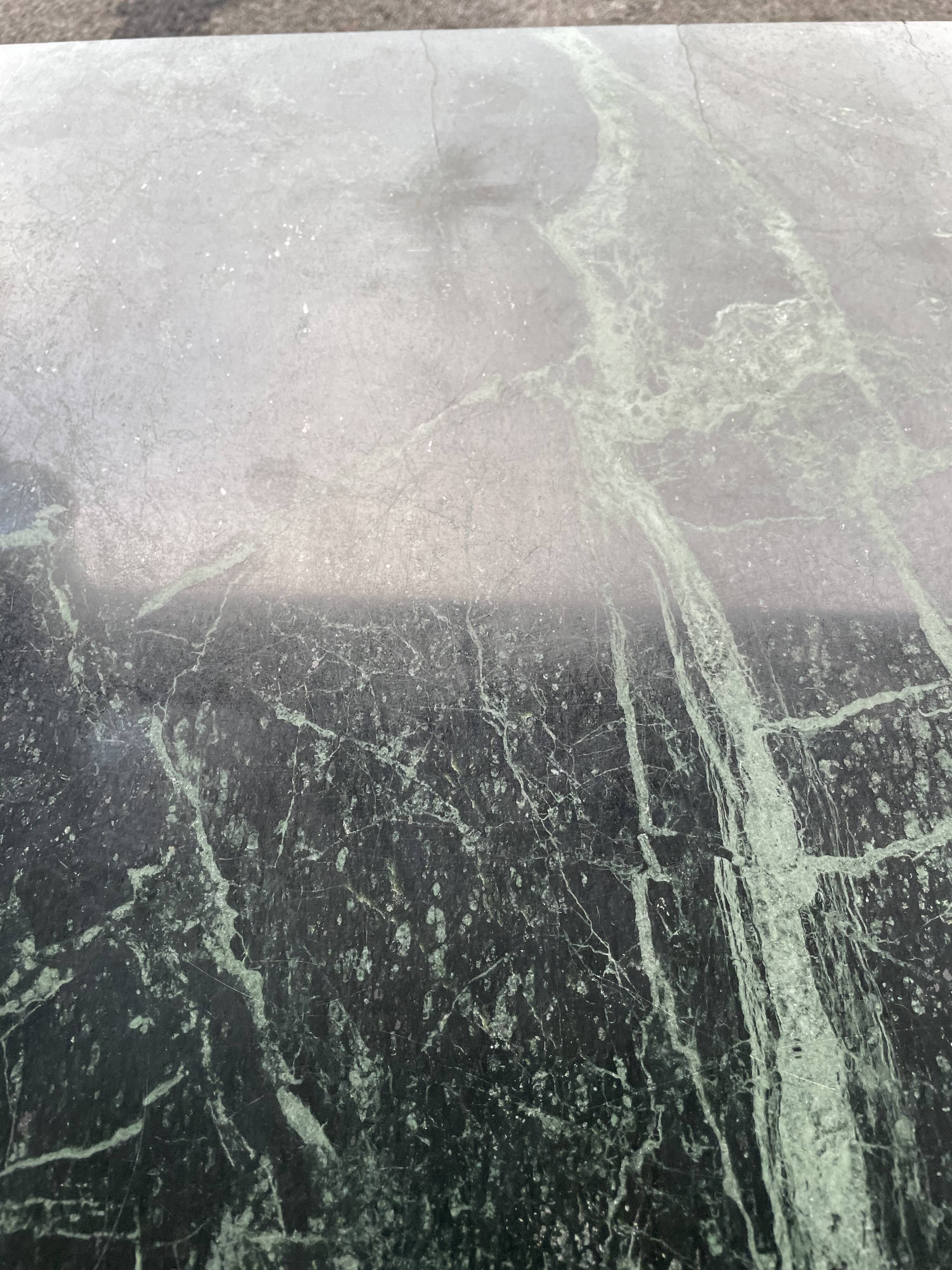 Coffee table in gilded brass and veined green marble