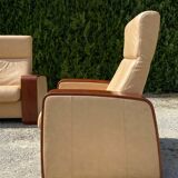 Set of vintage armchair and 2-seater sofa in beige leather and reclining wooden armrests, stressless style