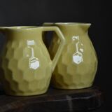 Raspberry carafe and two yellow pitchers