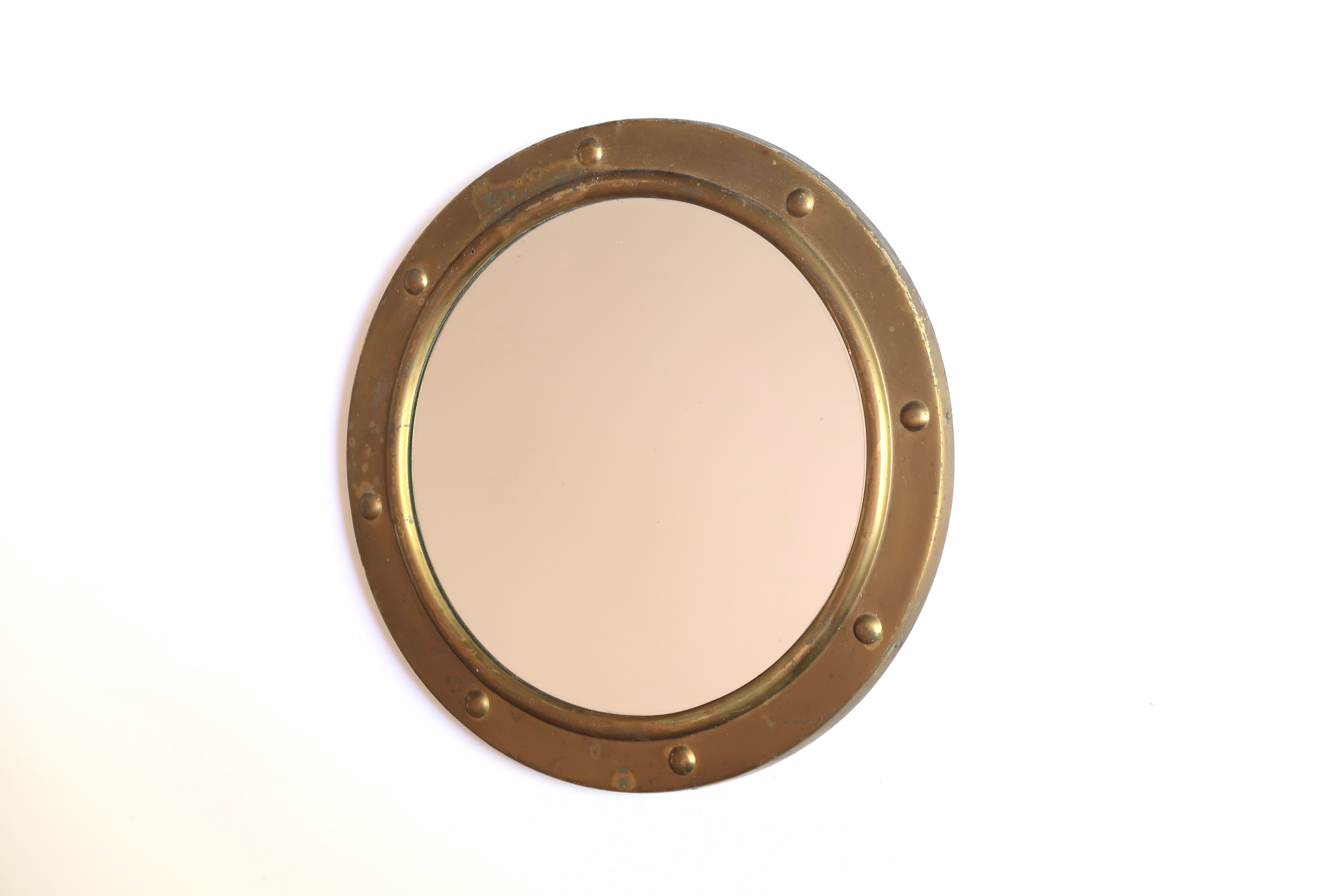 Round brass porthole mirror, 60s