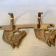 Wall-mounted coat rack with horses in brass