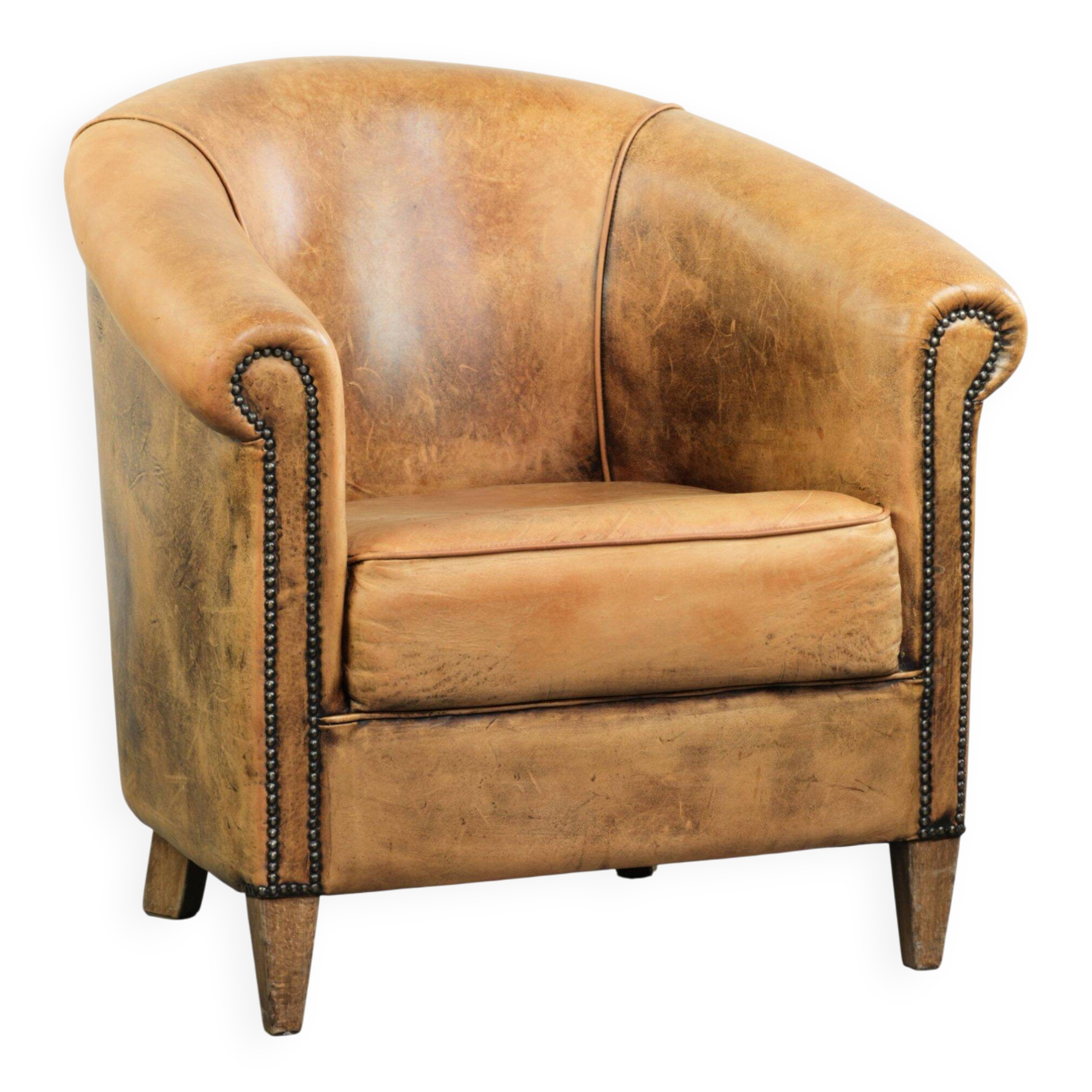 Vintage sheepskin club armchair in a light cognac colour