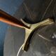 Elegant table lamp with a slender teak body on a tripod brass base, Germany, 1960s.