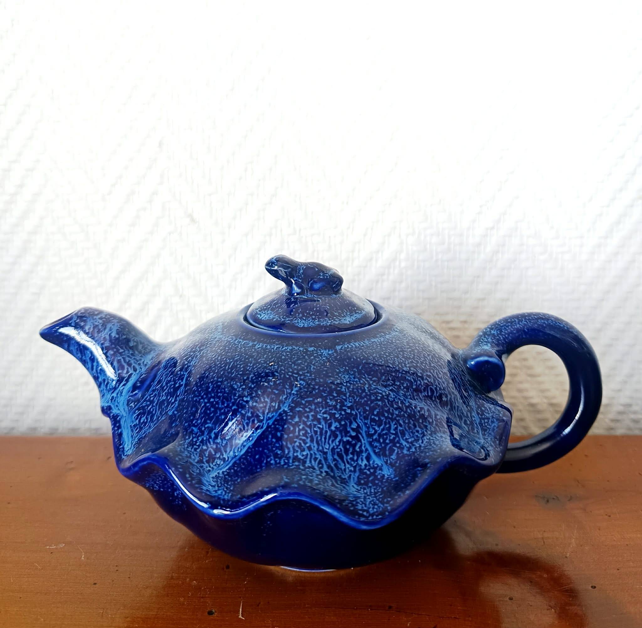 Blue ceramic Art Deco teapot with a frog.