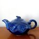 Blue ceramic Art Deco teapot with a frog.