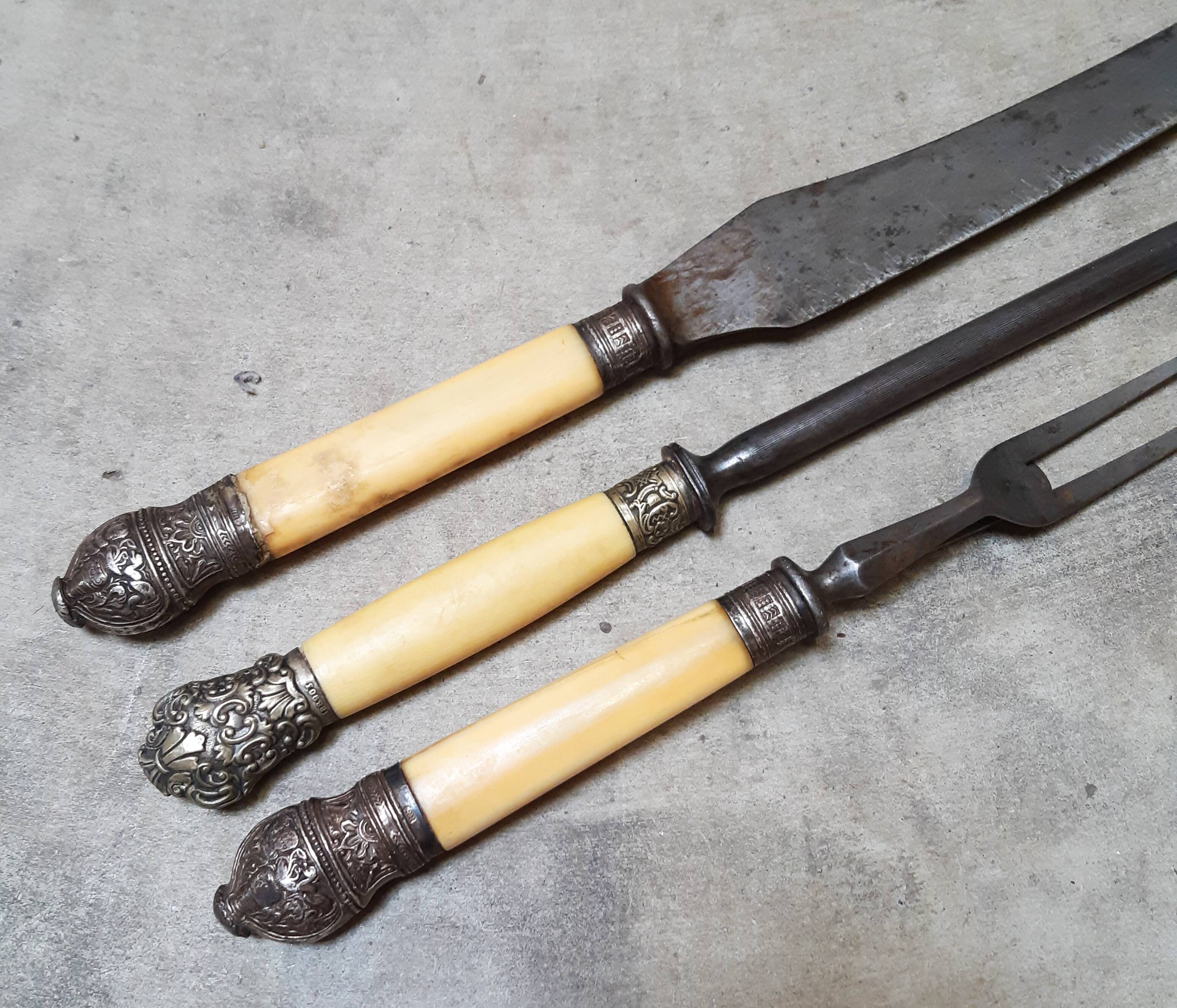 Assortment of antique serving cutlery