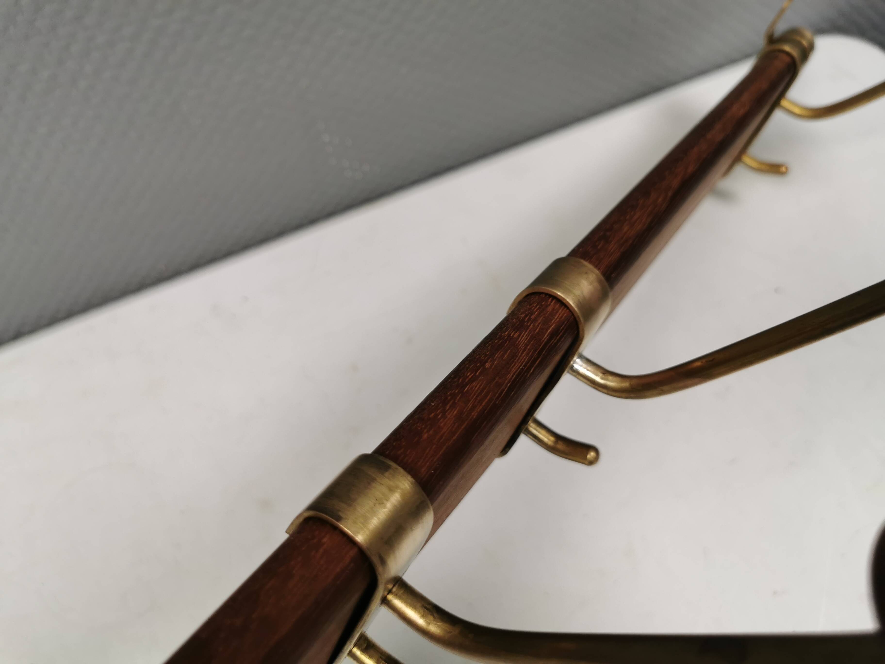 Danish teak and brass coat rack with adjustable hooks, 1960s.