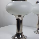 Pair of vintage futuristic style table lamps in chrome and opal glass.