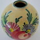 Vase "ball" decorated floral in polychrome earthenware glazed by Saint-Clement