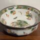 Shallow porcelain dish from Limoges Raynaud, bird decoration.