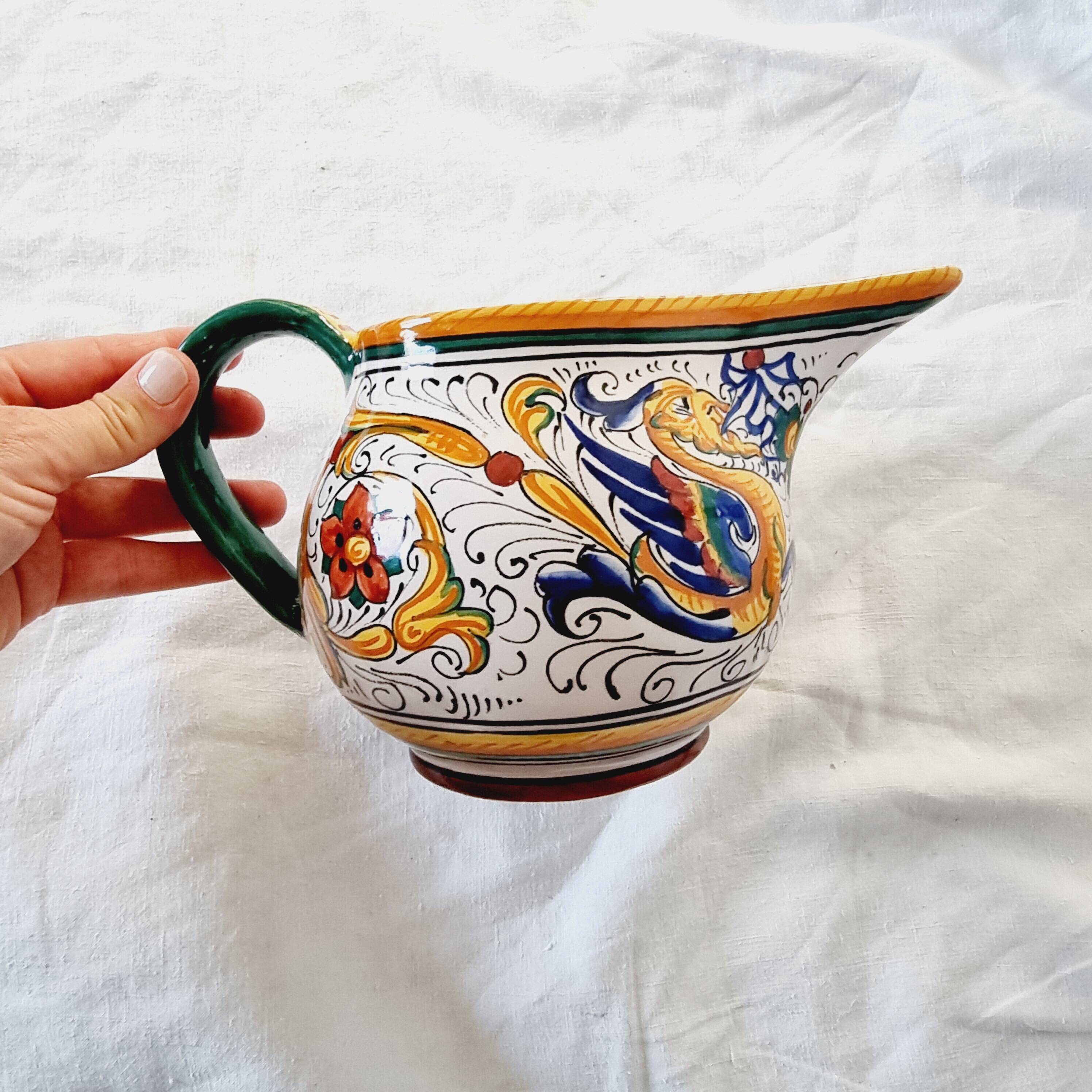 Majolica ceramic jug by R. Deruta, Italy, hand-painted, with a long spout.  Decorated with a dragon tree