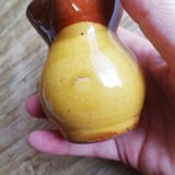 Small two-tone brown-yellow terracotta pitcher