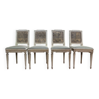 Suite de 4 chaises cannées style Louis XVI Jean Mocque