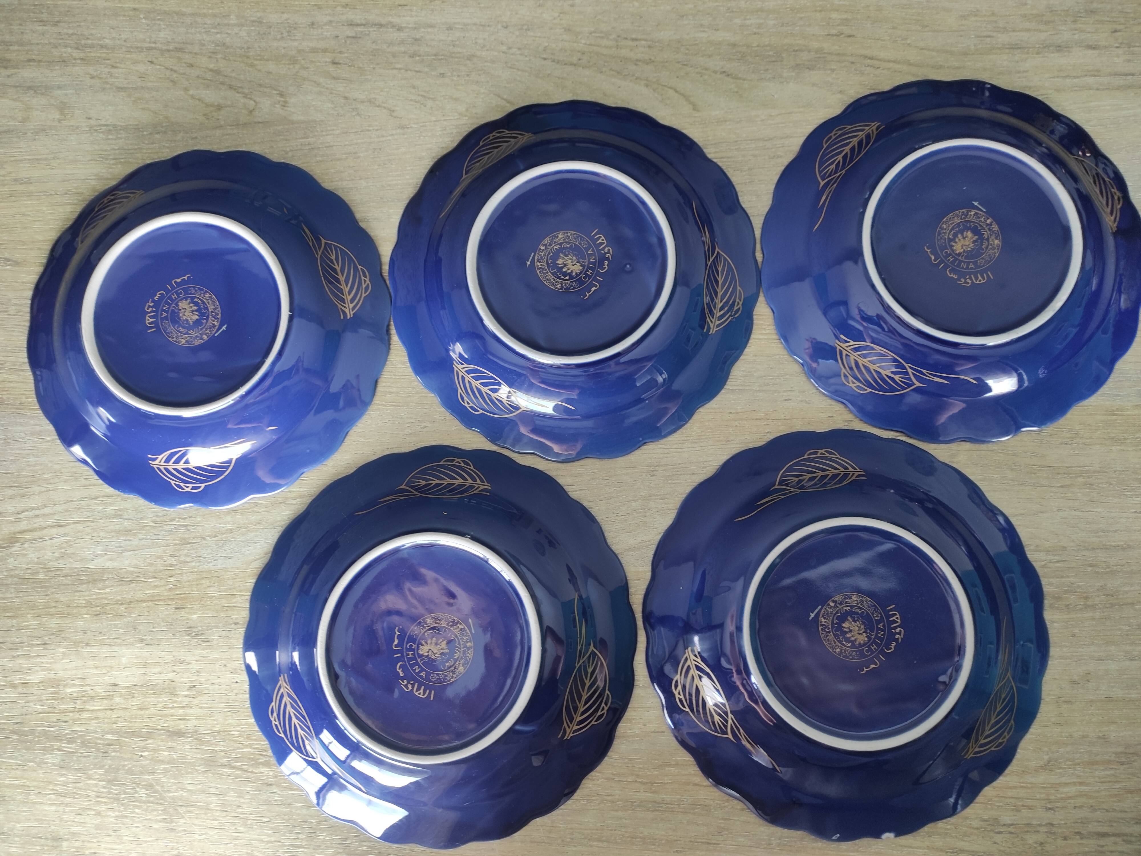 Vintage blue Taous dinnerware set of 21 pieces in very good overall condition.