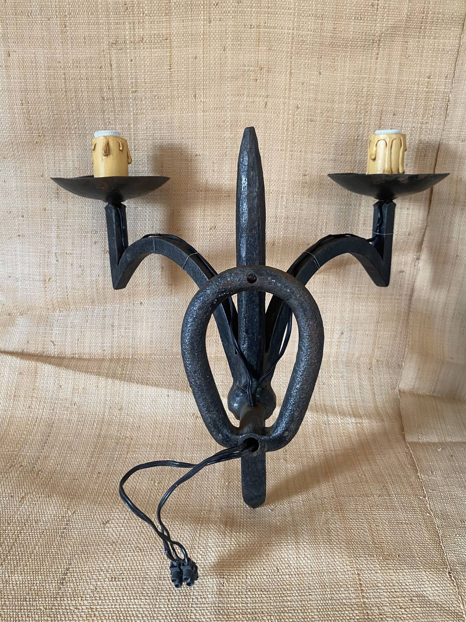 Wrought iron wall lights.