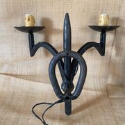 Wrought iron wall lights.