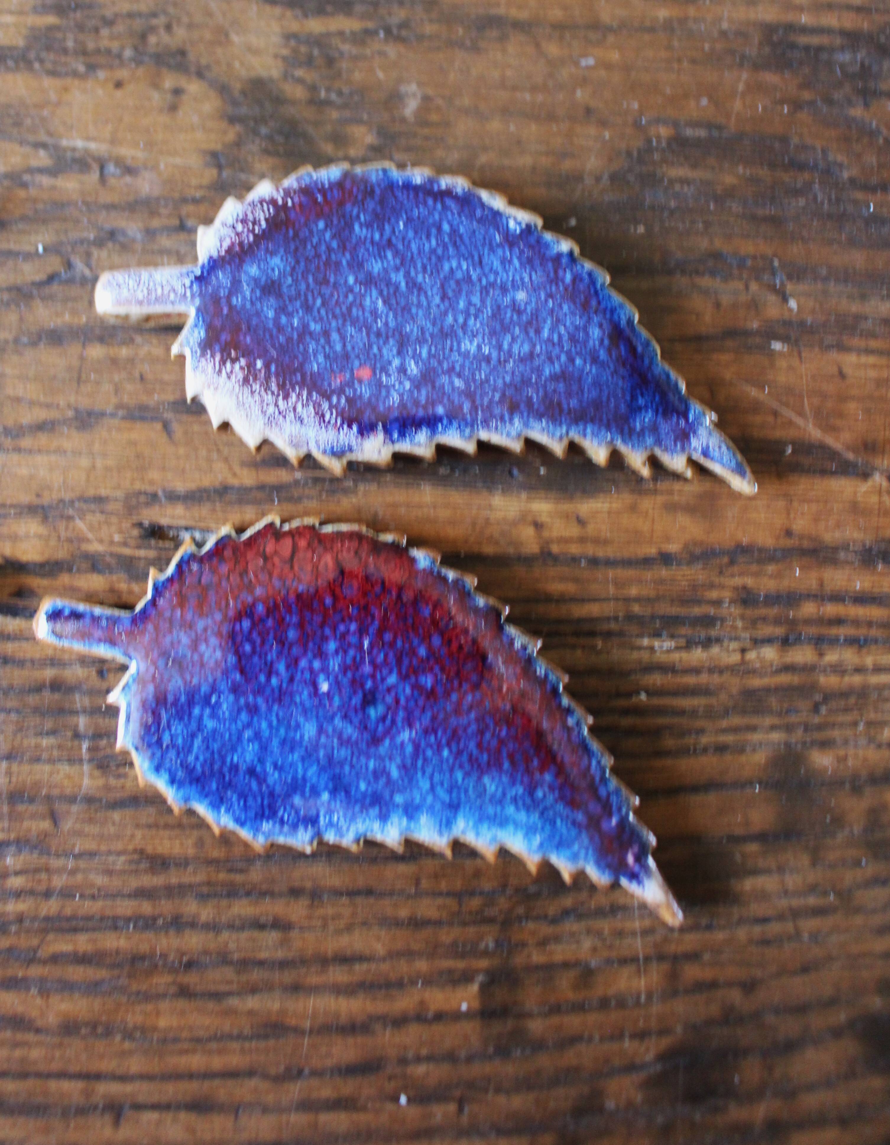 A set of 4 handcrafted pottery knife rests in blue.