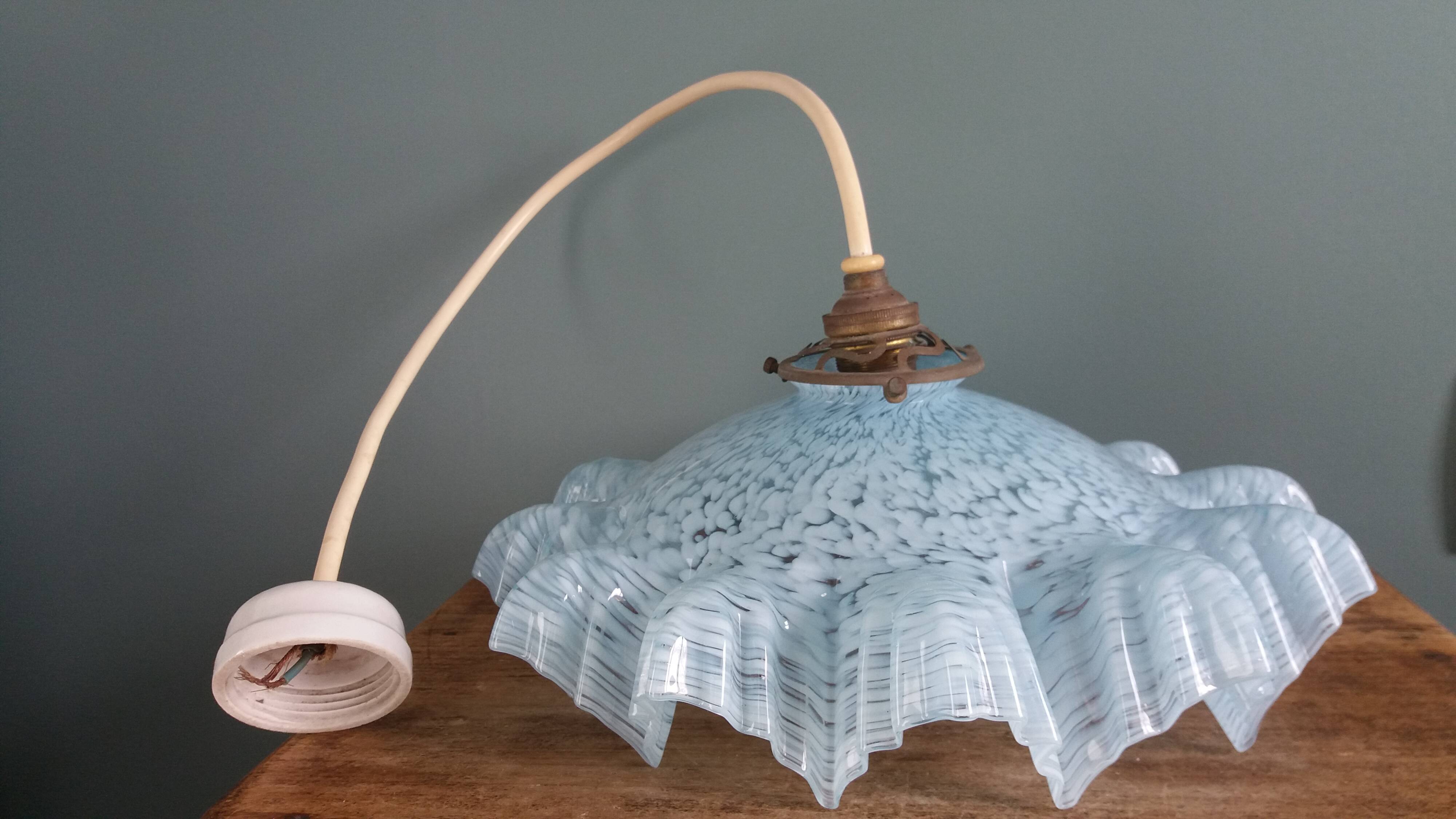 Suspension light with a sky blue glass shade from Clichy, snowflake shape.