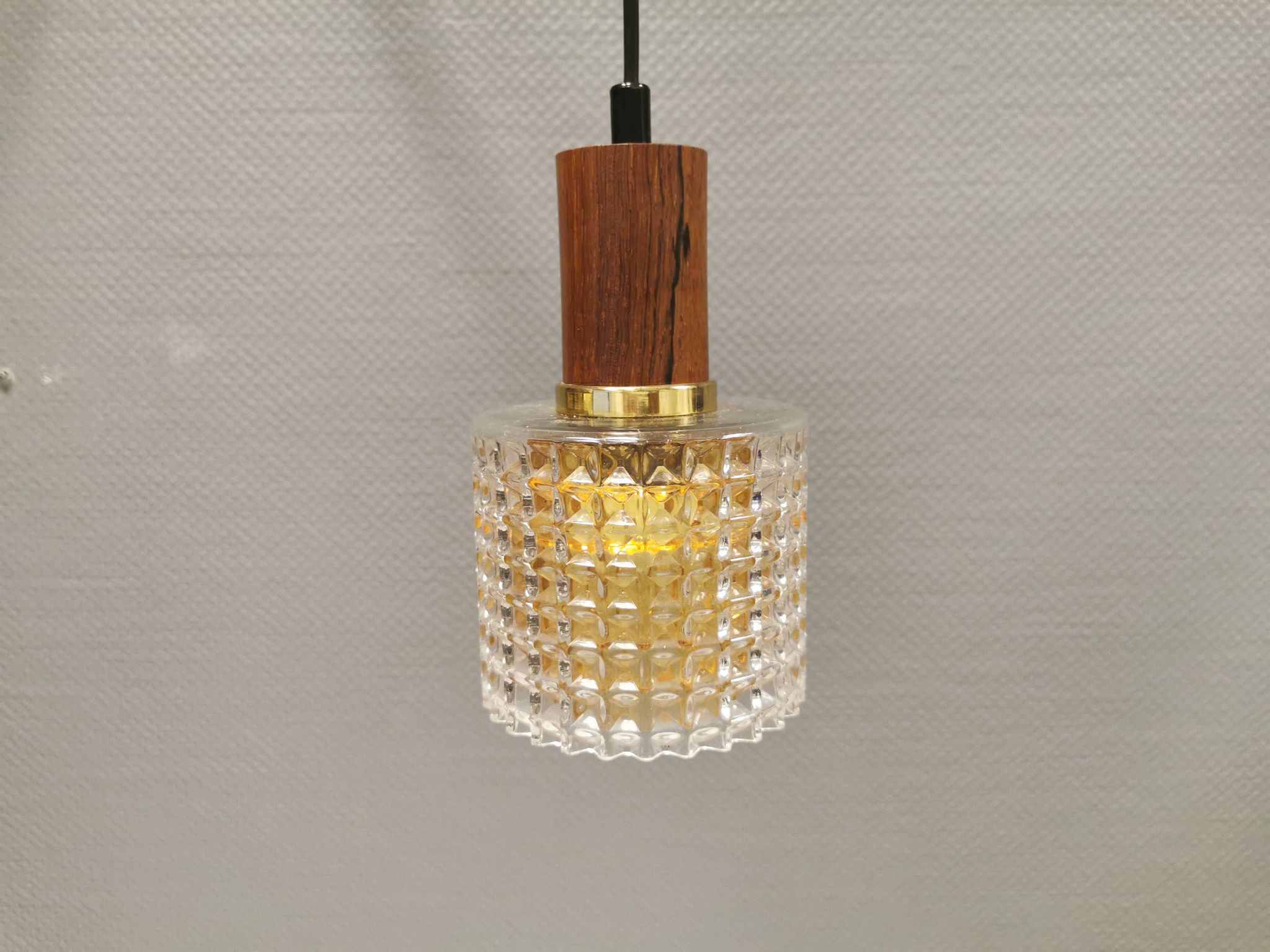 Older Swedish hanging lamp in multi-layered crystal glass with rosewood top and brass ring.