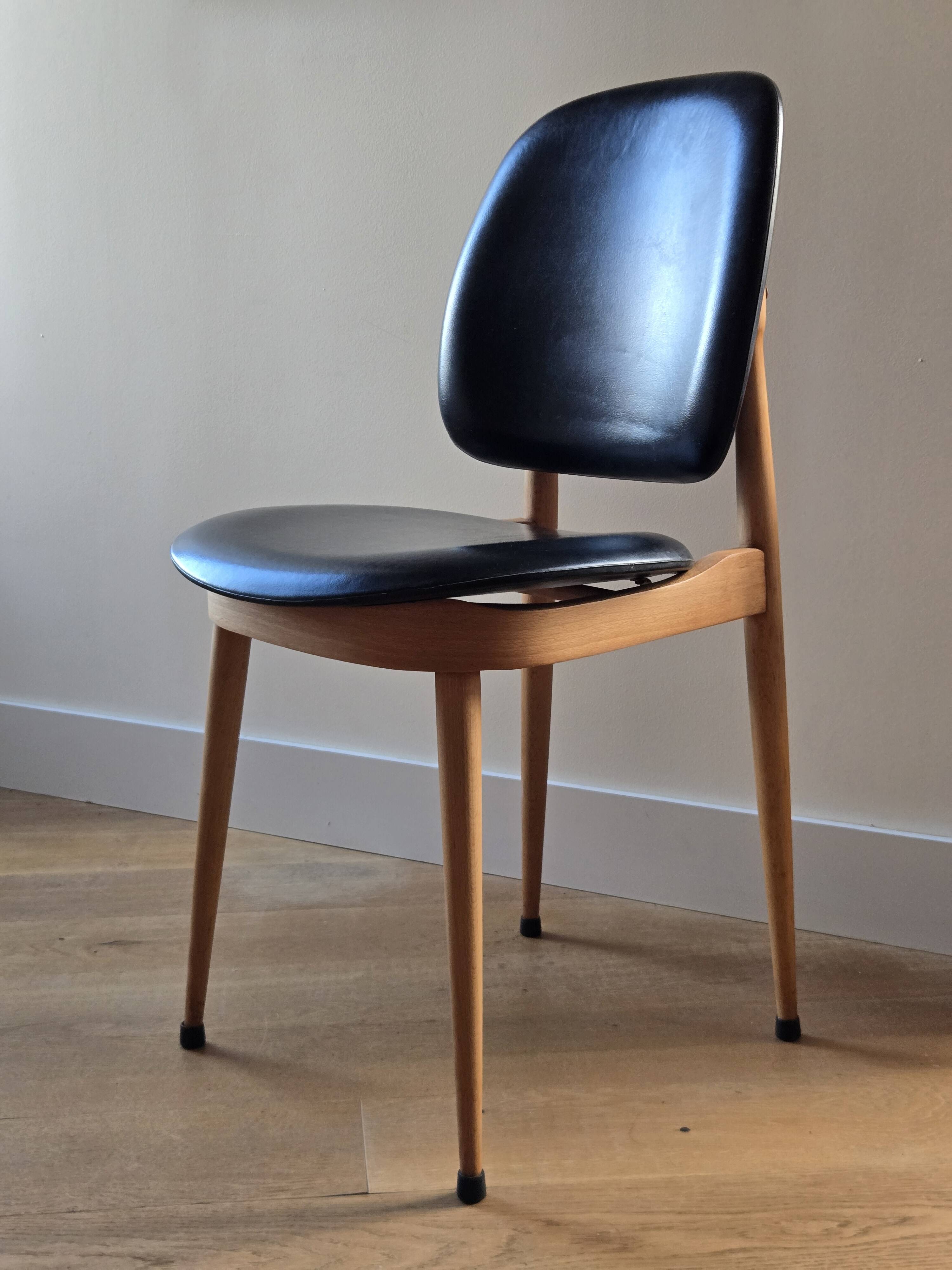 Pair of Baumann Pegasus chairs in wood and leather - design by Pierre Guariche