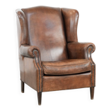 Vintage wingback armchair made of sheepskin leather with beautiful colours