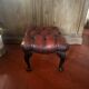 Red leather footrest in Chesterfield style, vintage 1970s.