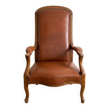Classic vintage armchair in brown leather and oak