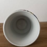 Adorable small porcelain vase from Paris with floral decoration.
