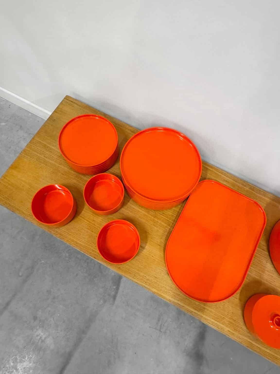 Vintage “Max” orange plastic dinnerware set 1964
