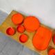 Vintage “Max” orange plastic dinnerware set 1964