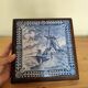 Ceramic tile trivet and wooden frame with Dutch windmill.