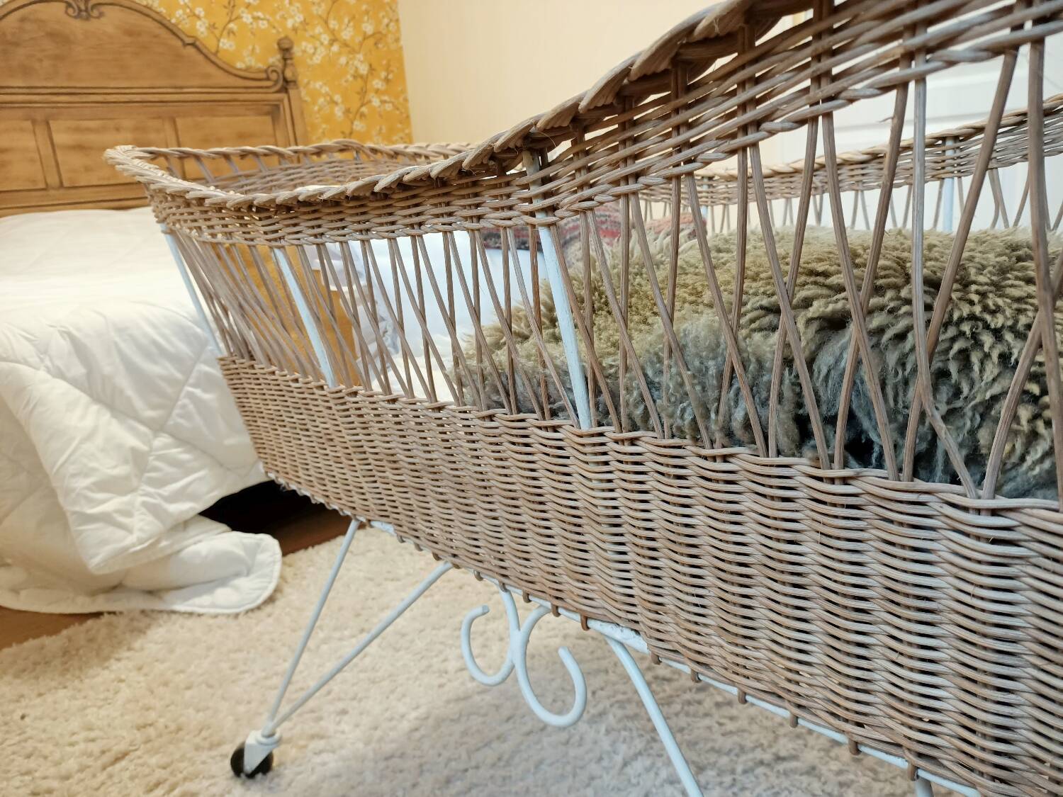 Rattan and wrought iron cradle