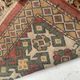 Antique wool rugs with designs on a red background, 20th century.