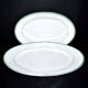 Limoges set of 2 old oval porcelain dishes with green and gold edging