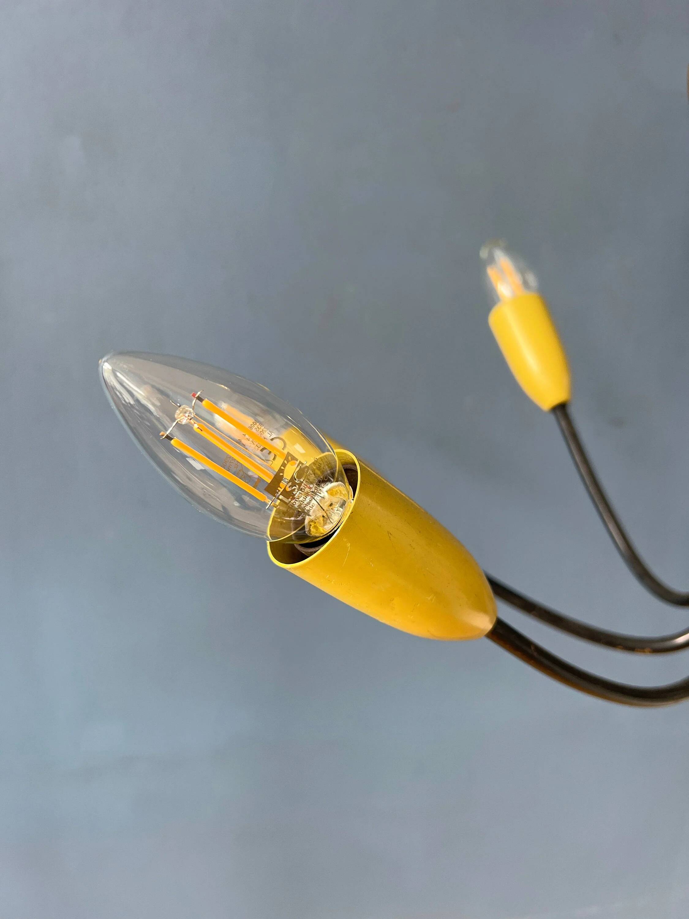Vintage yellow spider suspension from the 1950s.