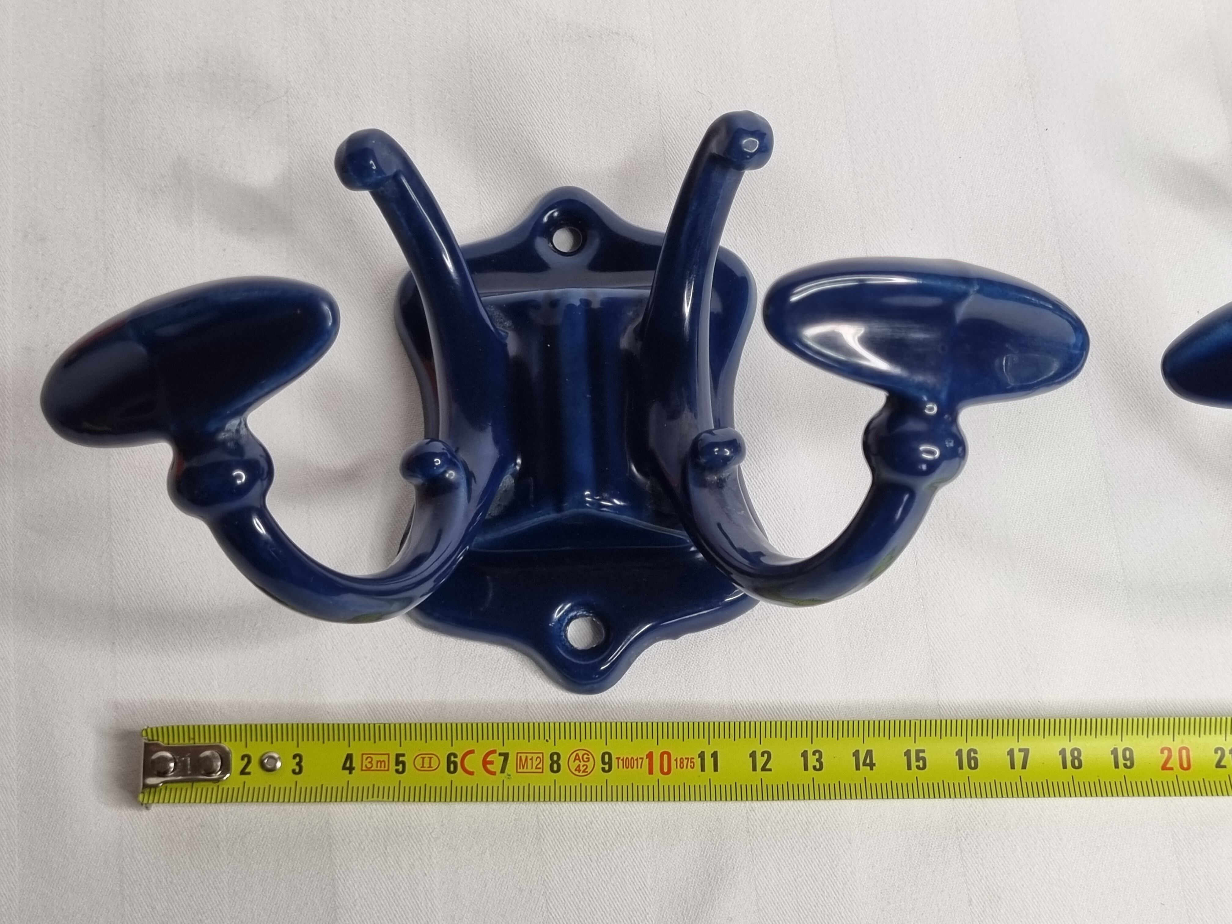 Pair of 1910 art nouveau period coat hooks in blue enameled cast iron