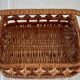 Old wicker basket with diamond-shaped decorations