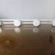Wall coat rack with 4 hooks in white lacquered metal 1970