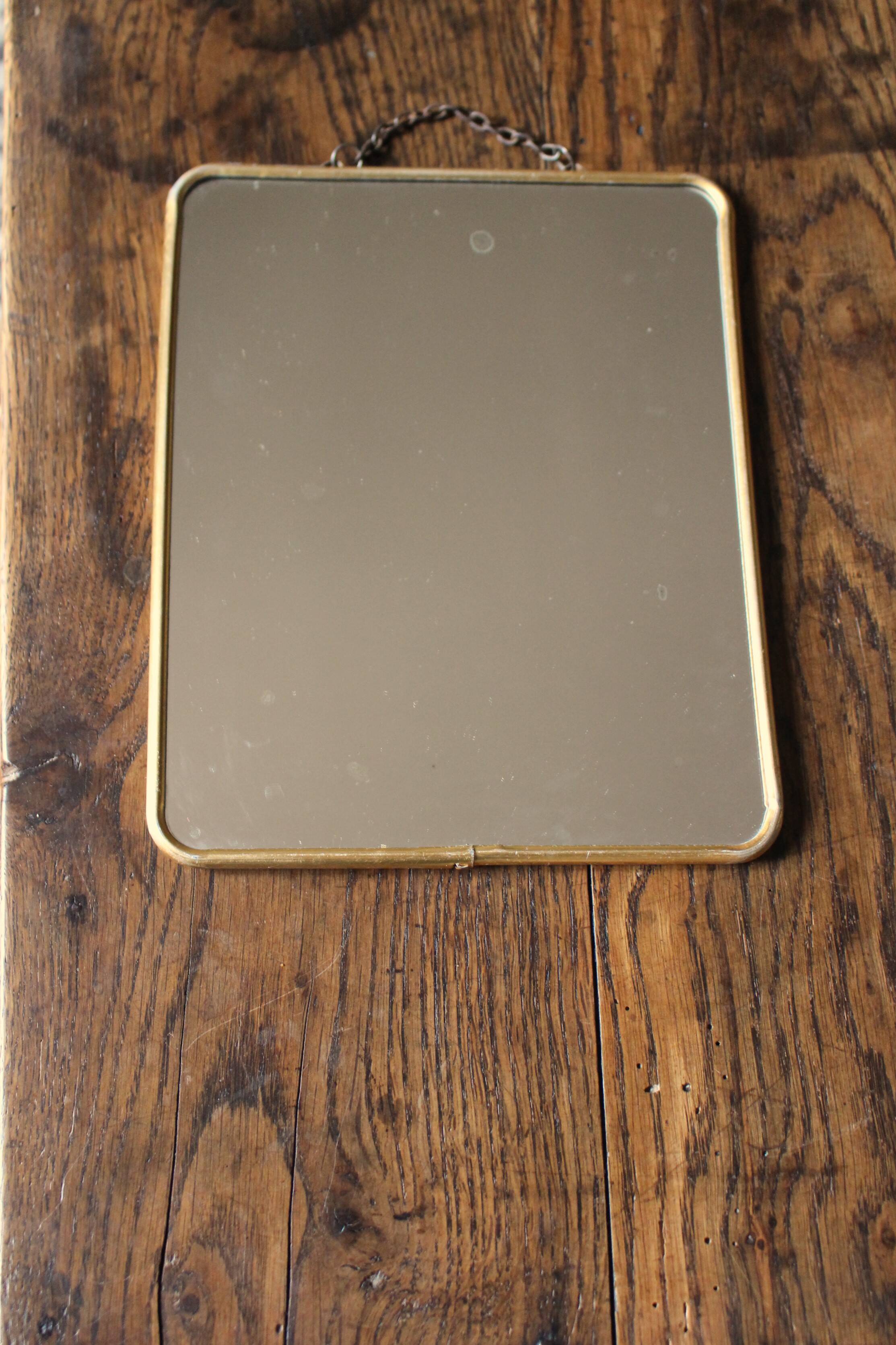 Simple barber mirror with gold metal chain