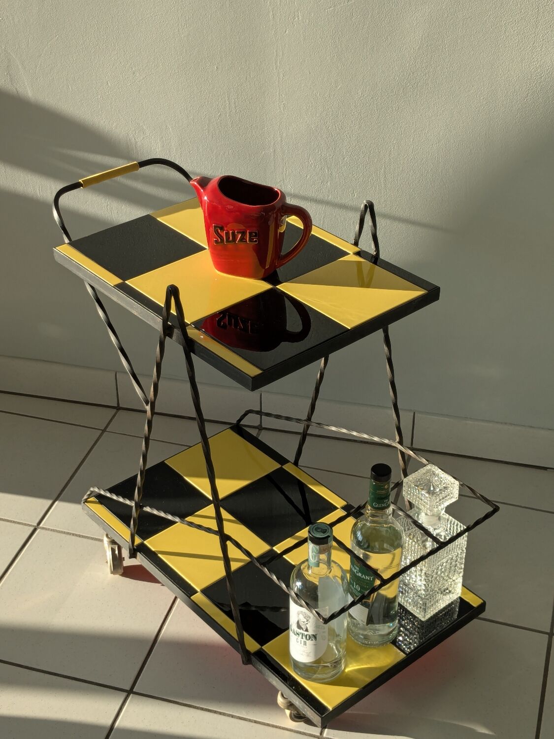 Vintage black and yellow checkered rolling bar trolley
