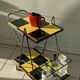 Vintage black and yellow checkered rolling bar trolley