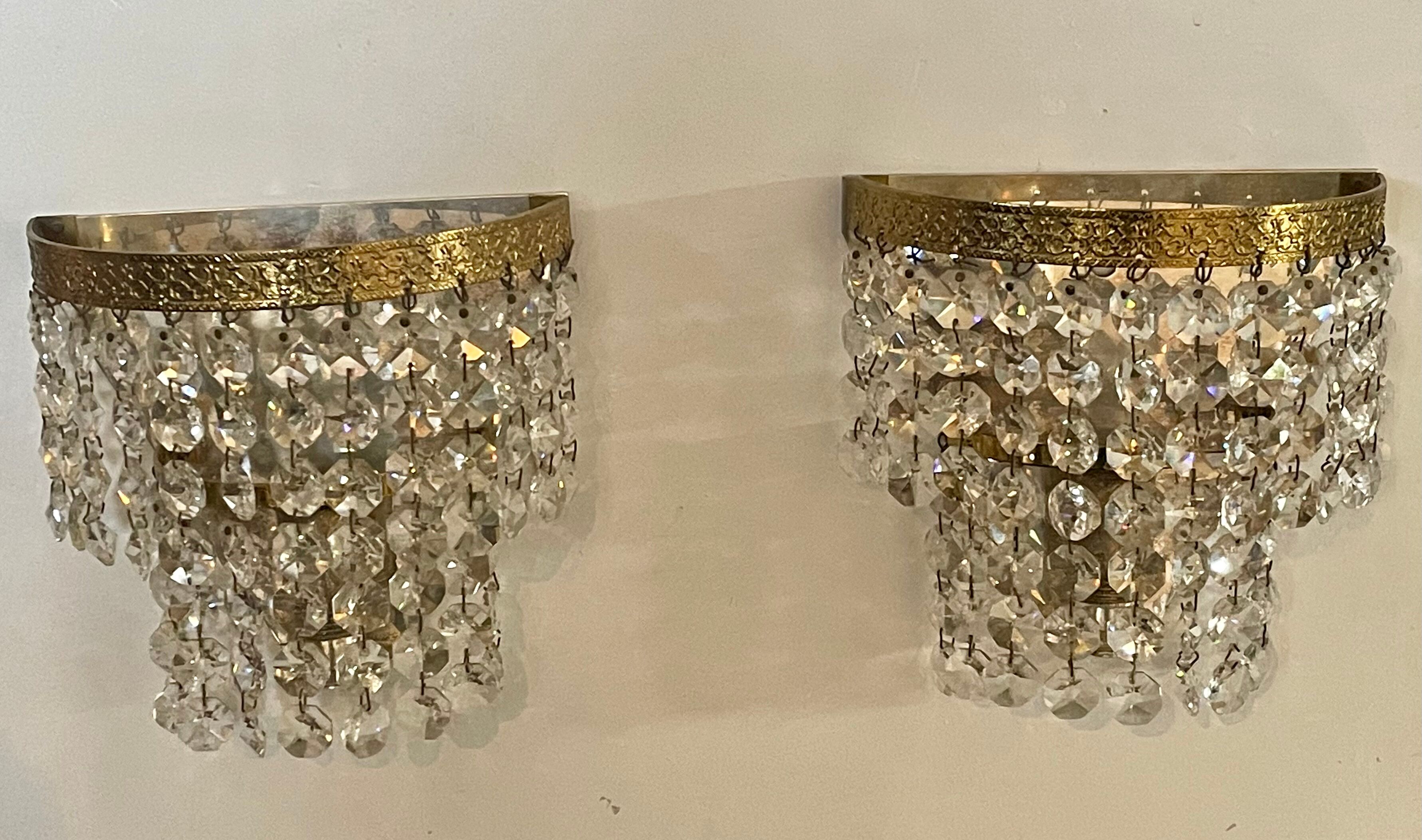 Pair of brass sconces and tassels