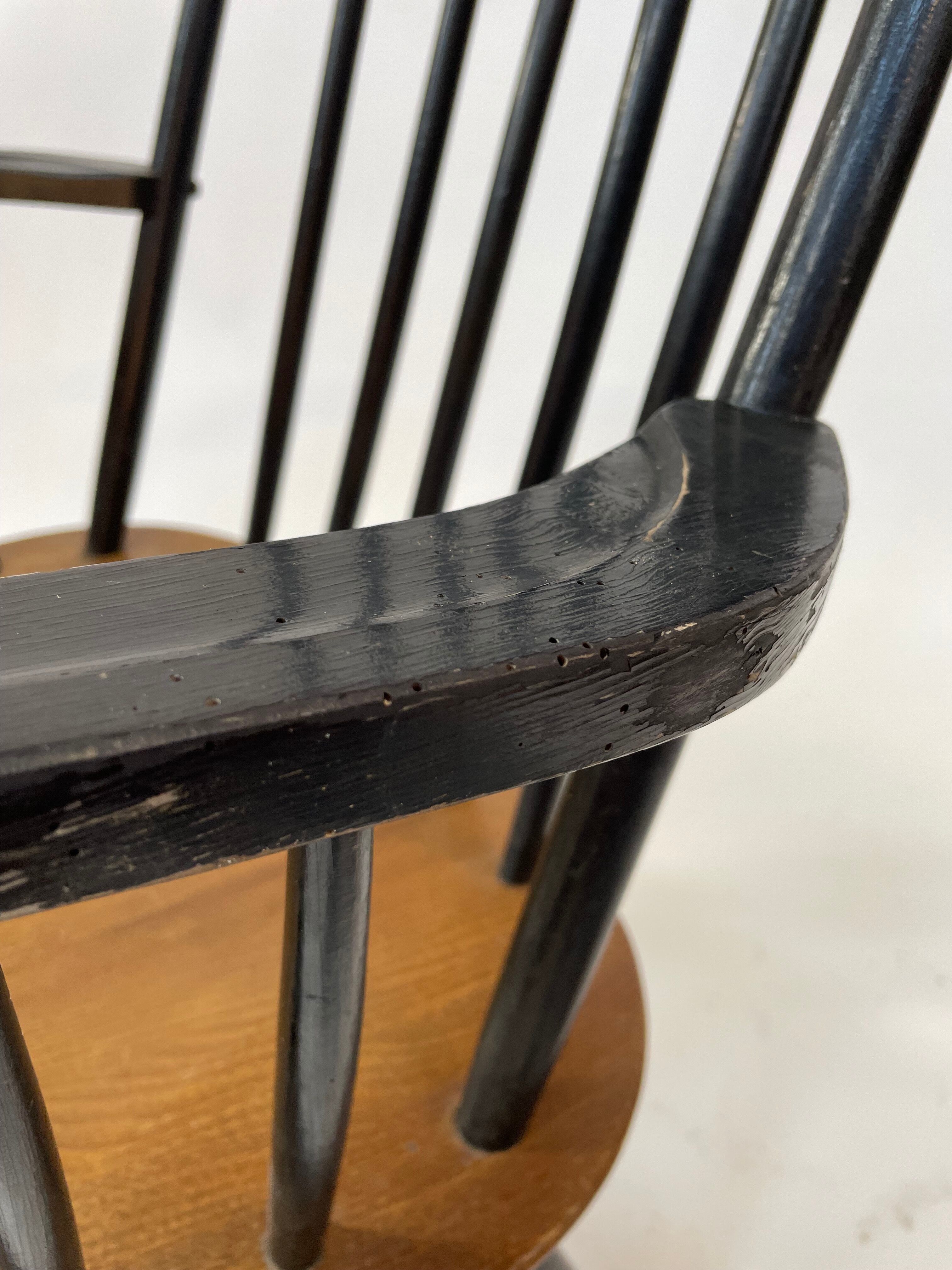 Vintage easy chair with high back and armrest from the 60s
