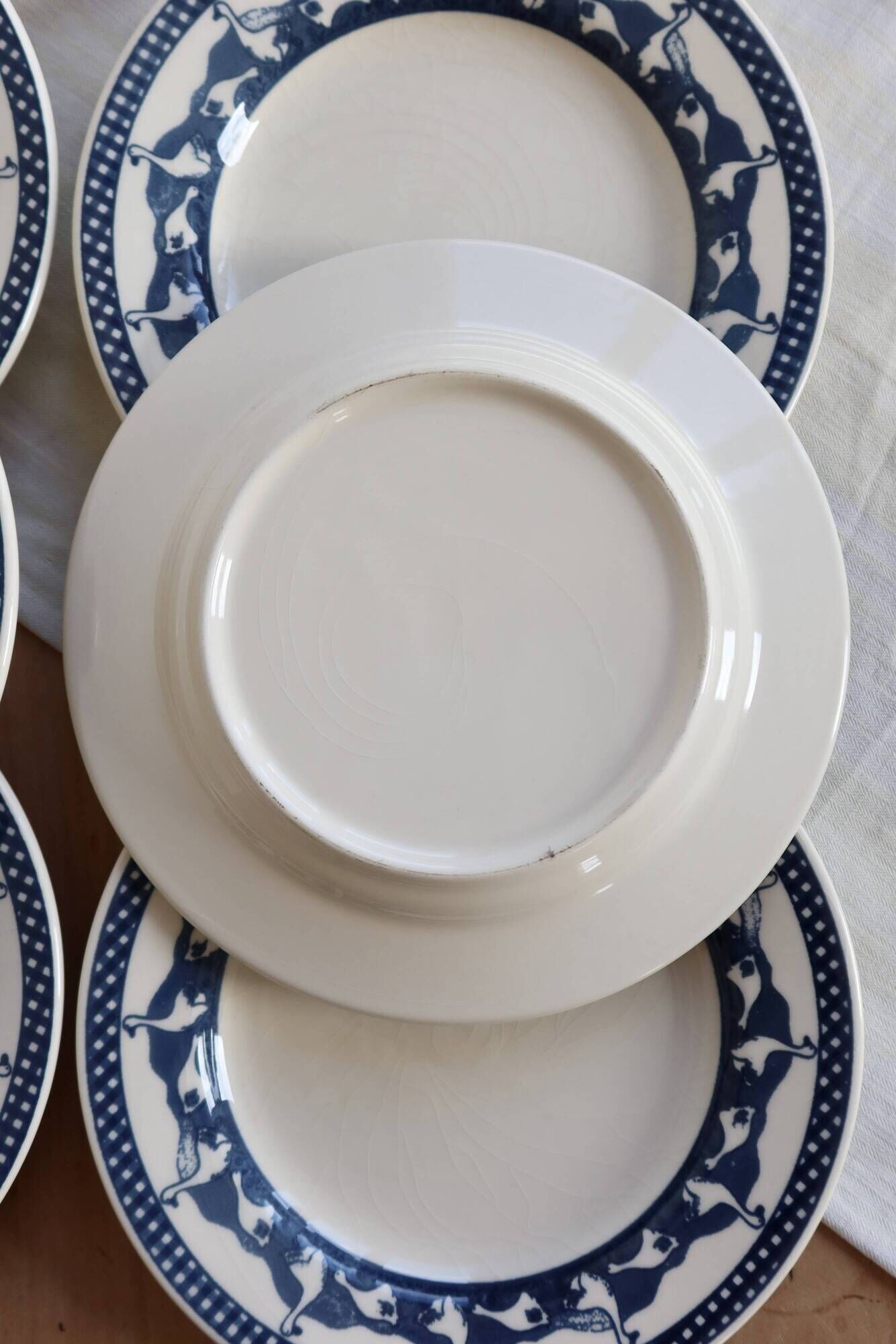 6 vintage flat plates with a blue and white goose pattern.